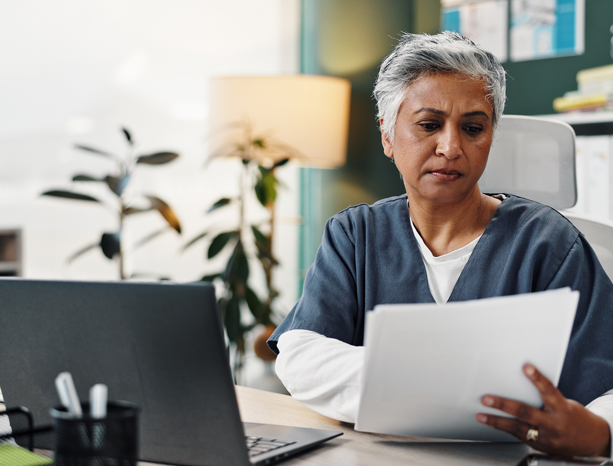 Section 2 Image - Nurse Looking at Admin Documents