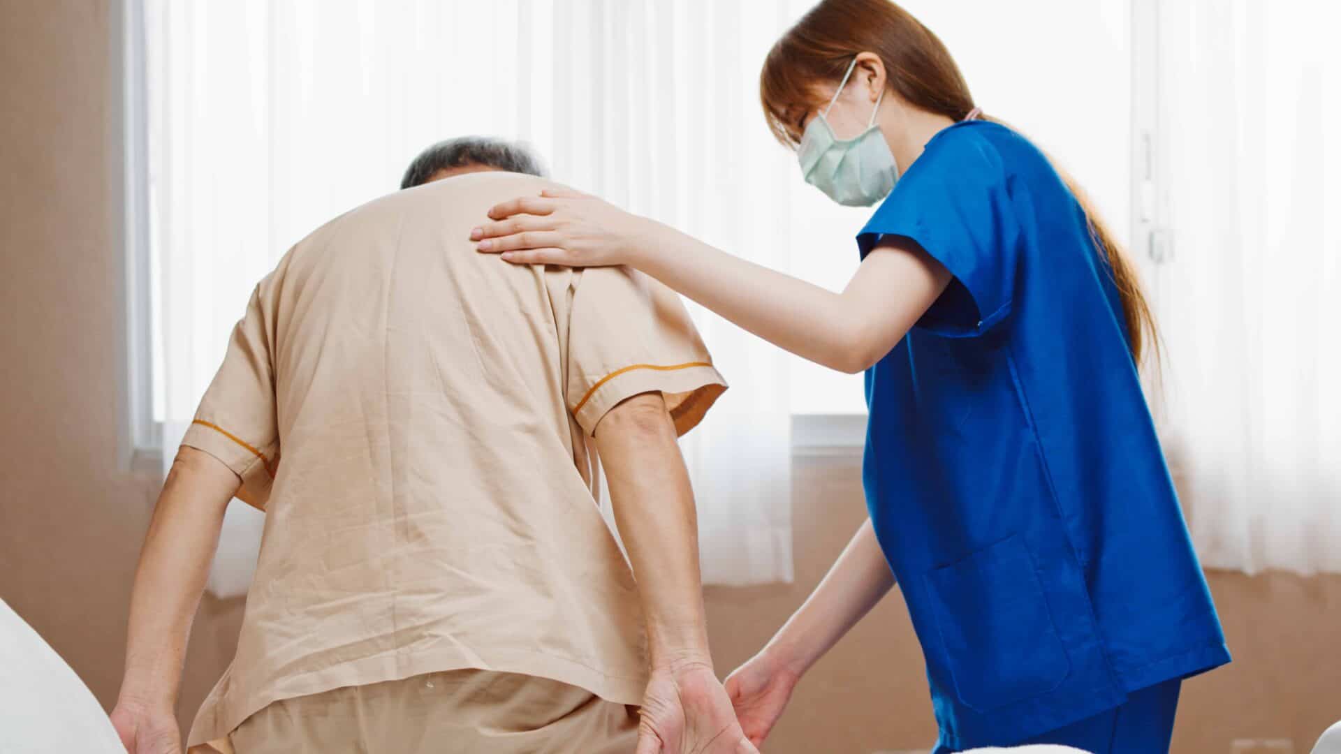 Moving and handling training - a carer helps a patient