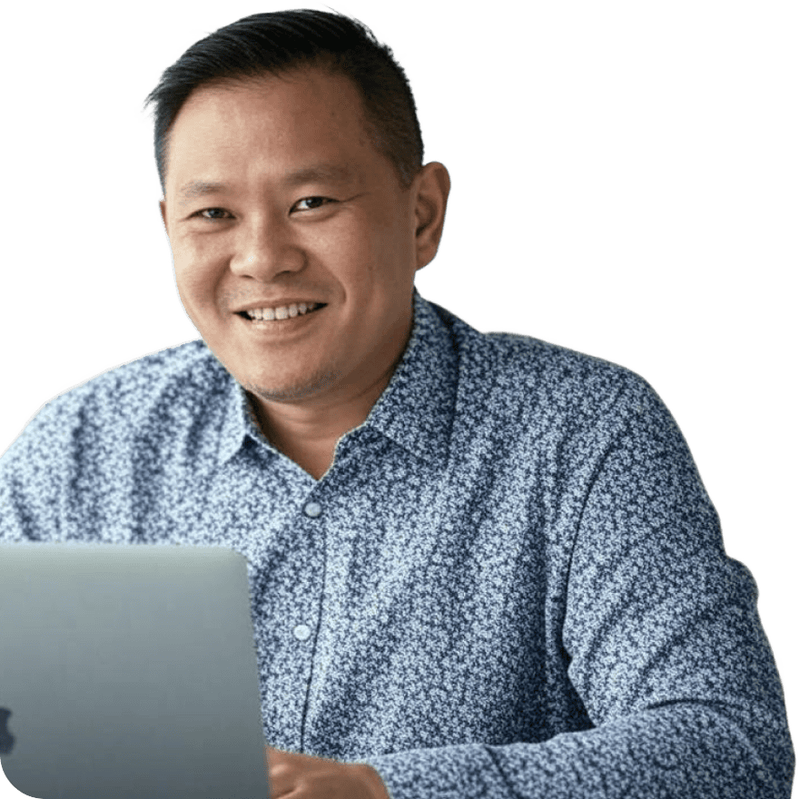 Dental professional working on a laptop