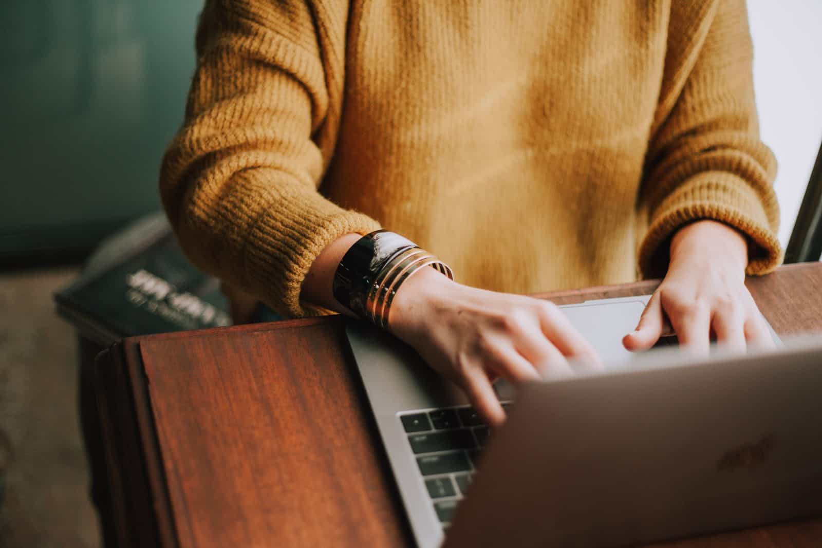 Woman accessing a GP practice website using a laptop